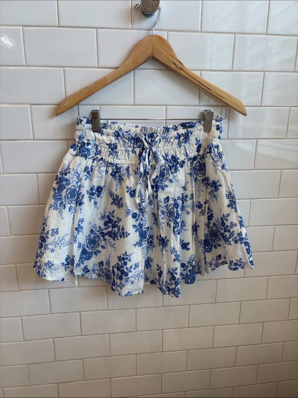 Francesca's Collections Blue and White Floral Drawstring Top